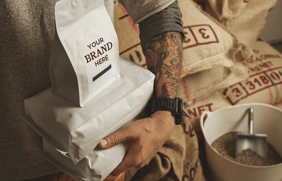 Entrepreneur planning a private label coffee brand launch, avoiding common mistakes in manufacturing, packaging, and market strategy